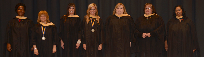 graduates smiling